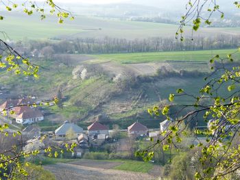 Scenic view of landscape and houses against mountains