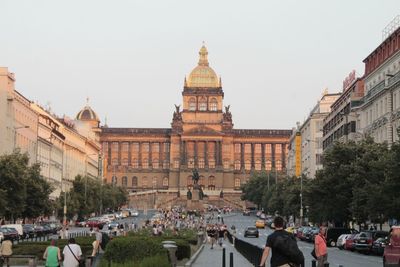 Group of people in front of buildings