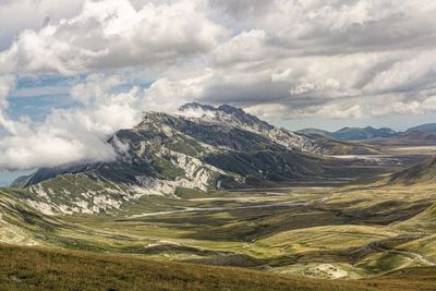 Aerial view of landscape and mountains against sky