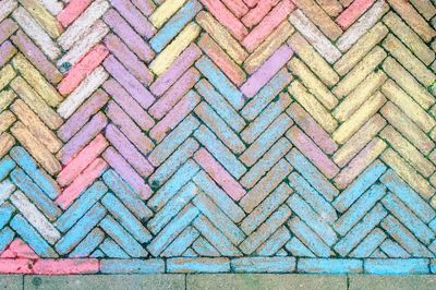 High angle view of colorful herringbone pattern footpath
