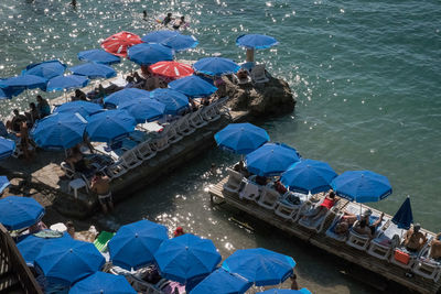 High angle view of people on boats in sea