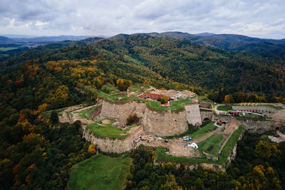 Srebrna gora fortress and sudety mountains at autumn season, aerial drone view
