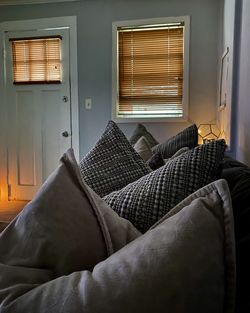 Cozy shades of grey and copper in historic row-home living room. 