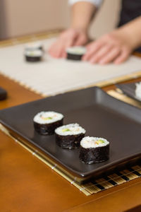 Close-up of sushi served on table