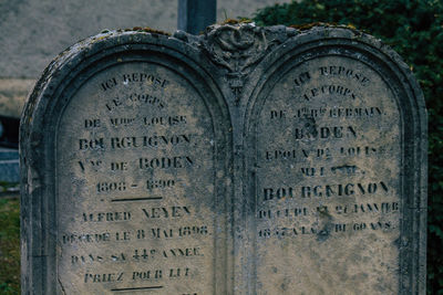 Close-up of text on stone at cemetery