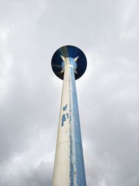 Low angle view of communications tower against sky