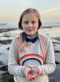 Portrait of girl standing on beach