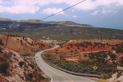 Road amidst landscape against sky