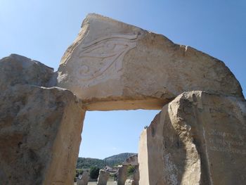 Low angle view of old ruins against sky