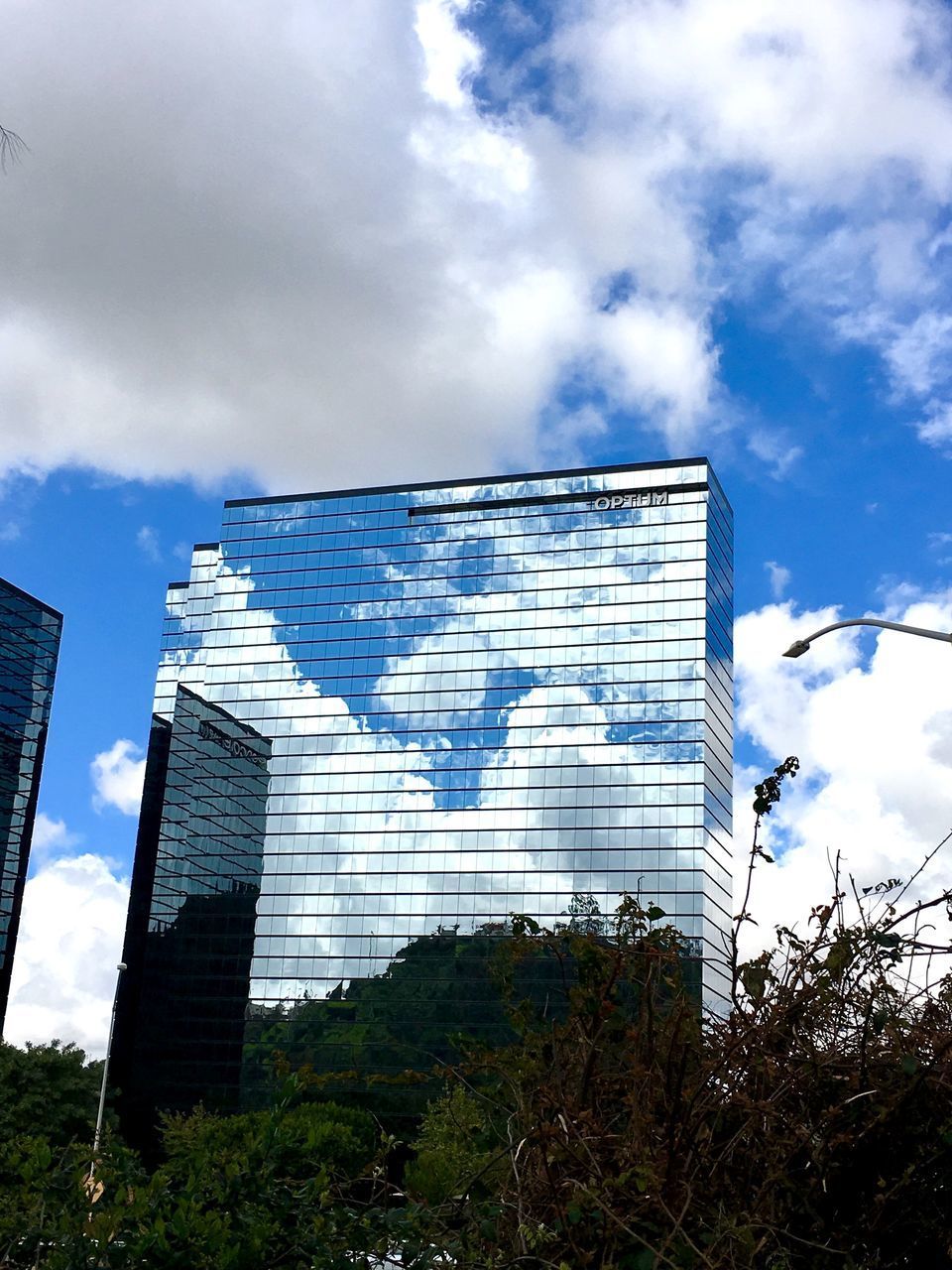 LOW ANGLE VIEW OF OFFICE BUILDING AGAINST SKY