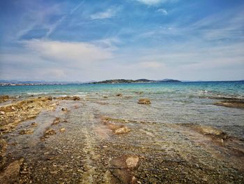 Scenic view of beach against sky