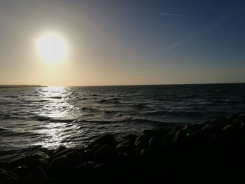 Scenic view of sea against clear sky during sunset