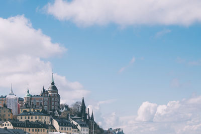 View of city against cloudy sky