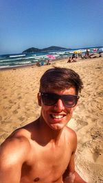 Portrait of a smiling young man on beach