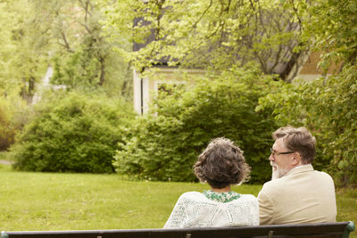 Couple sitting on bench together