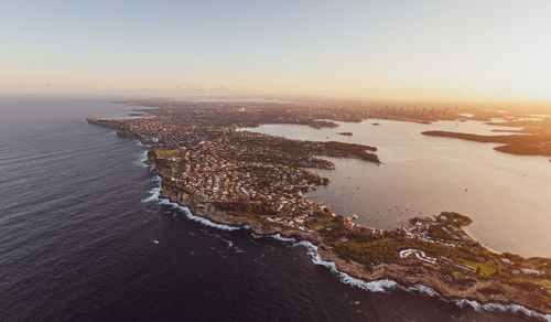 Drone view of south head, watsons bay with sydney harbour, cbd and harbour bridge in the background