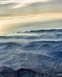 Scenic view of beach against dramatic sky