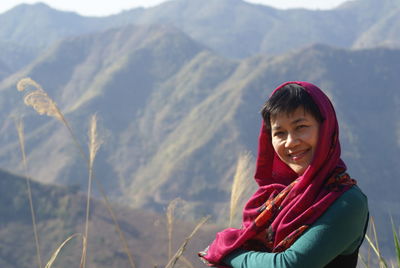 Portrait of woman against mountains