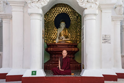 Statue against historic building