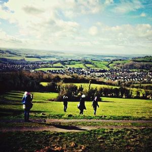 People on grassy field