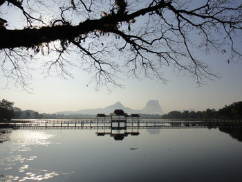 Scenic view of lake against sky at sunset