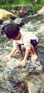 Boy playing in water