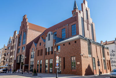 Low angle view of building against blue sky