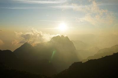 Natural landscape of green mountain range with cloudy mist sky