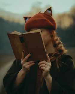 Woman reading an old book