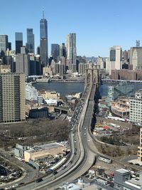 High angle view of city street and buildings against sky