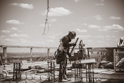Rear view of man sitting on chairs