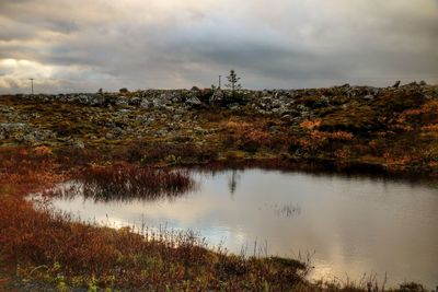 Scenic view of lake against sky during autumn