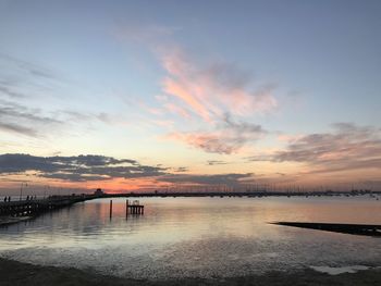 Scenic view of sea against sky at sunset