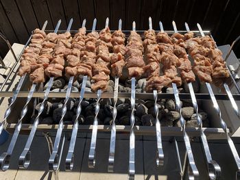 High angle view of meat on barbecue grill