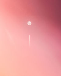 Close-up of pink moon against sky