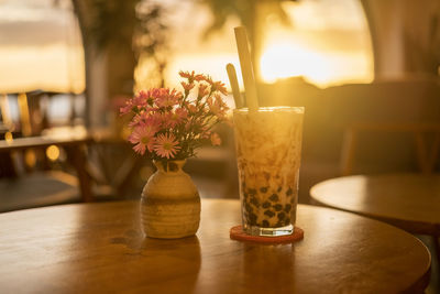 Close-up of glass vase on table in restaurant