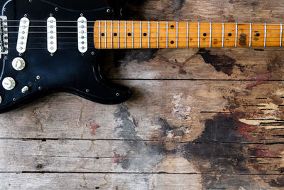 High angle view of guitar on table