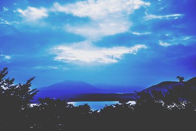 Scenic view of mountain against cloudy sky