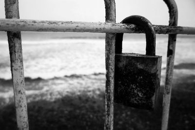 Close-up of padlock on gate