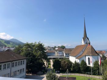 Houses and buildings against sky