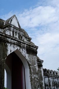 Low angle view of old building against sky