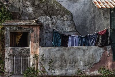 Low angle view of clothes drying against building