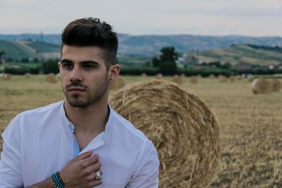 Portrait of man on field against sky