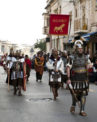 People walking on street in city