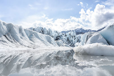 Scenic view of snowcapped landscape against sky