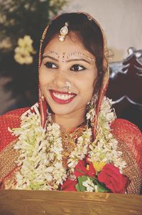 Close-up of smiling bride during wedding ceremony
