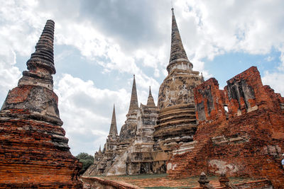 Low angle view of old temple against sky