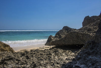 Scenic view of sea against clear blue sky