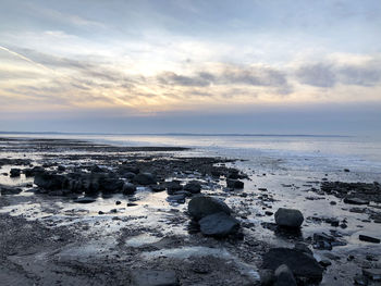 Scenic view of sea against sky during sunset
