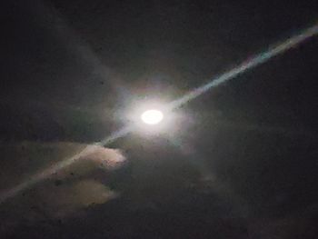 Low angle view of moon in sky at night